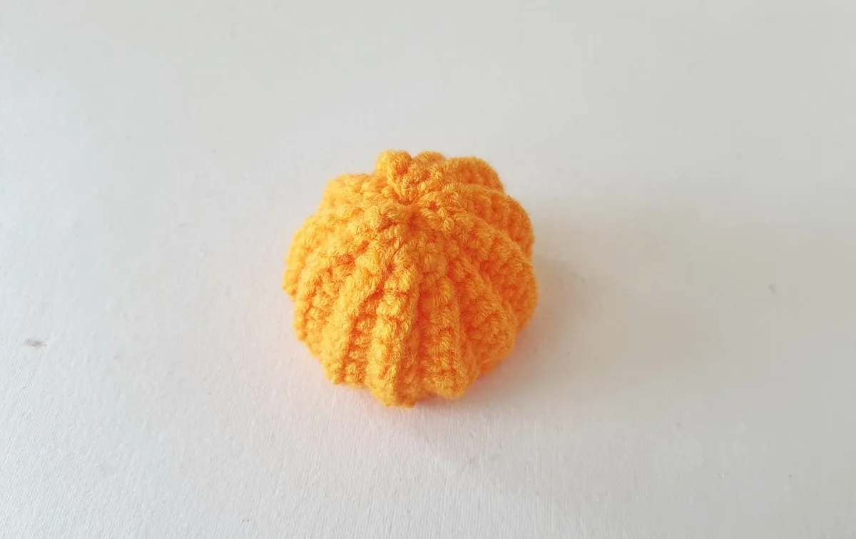 Crochet Pumpkin Step 17 against a white background