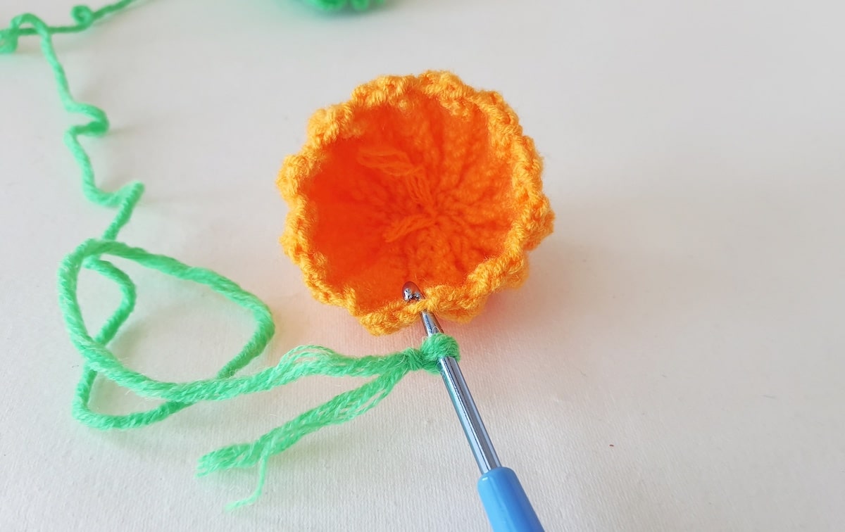 Crochet Pumpkin Step 19 against a white background
