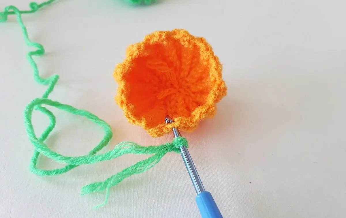 Crochet Pumpkin Step 19 against a white background
