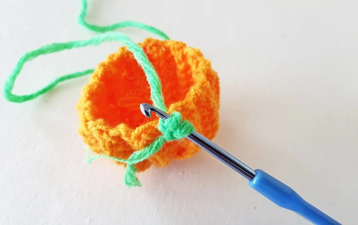 Crochet Pumpkin Step 20 against a white background