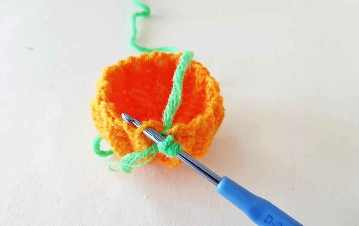Crochet Pumpkin Step 21 against a white background