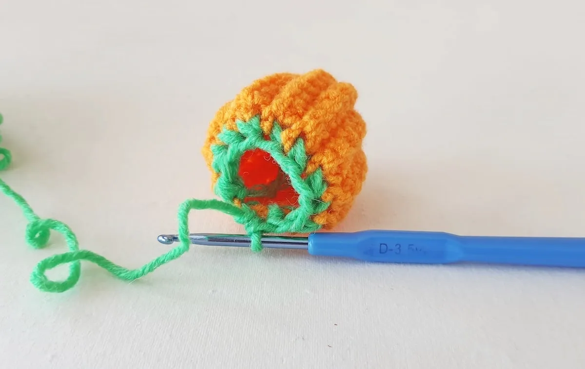 Crochet Pumpkin Step 26 against a white background