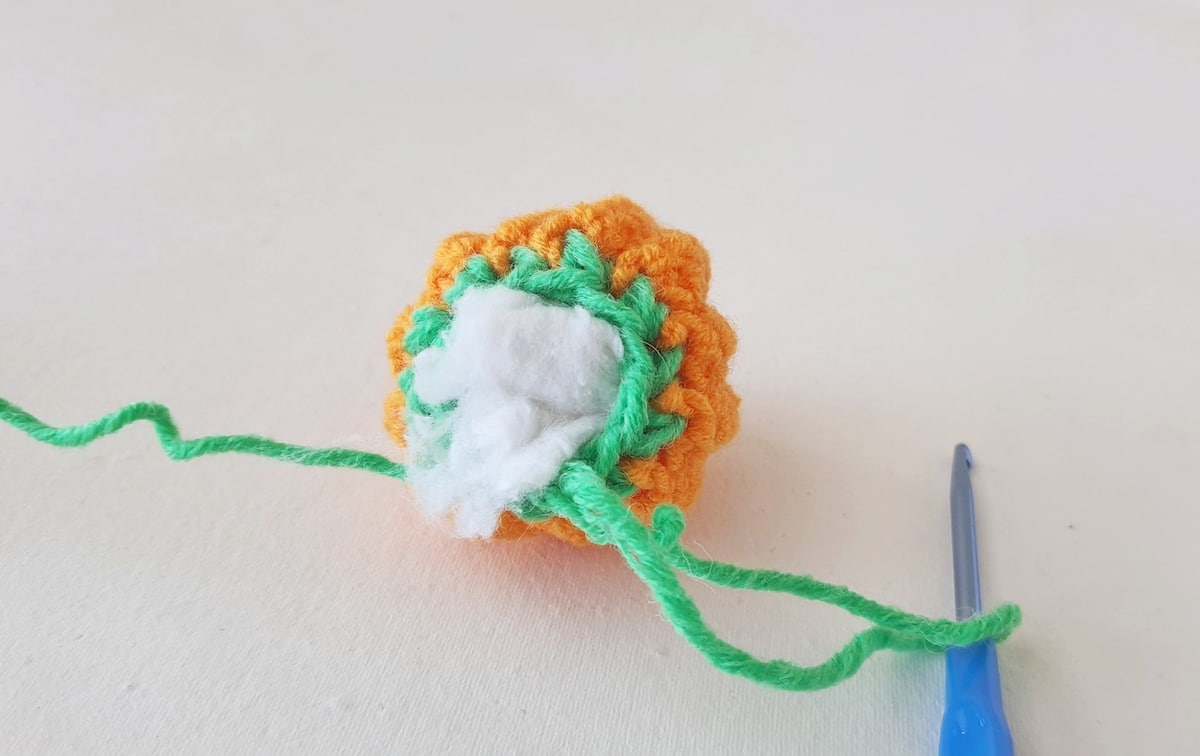 Crochet Pumpkin Step 27 against a white background