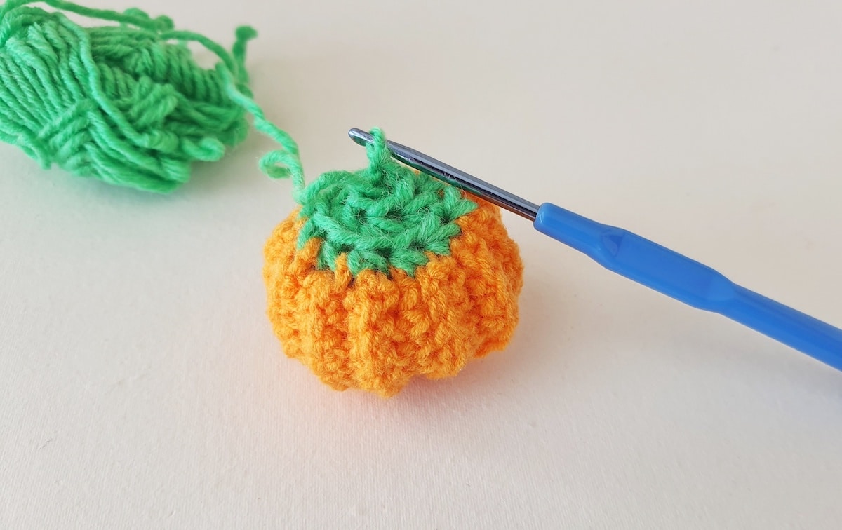 Crochet Pumpkin Step 29 against a white background