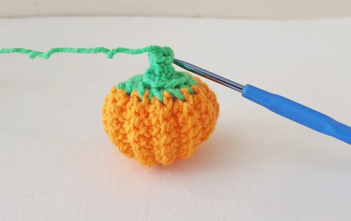 Crochet Pumpkin Step 30 against a white background