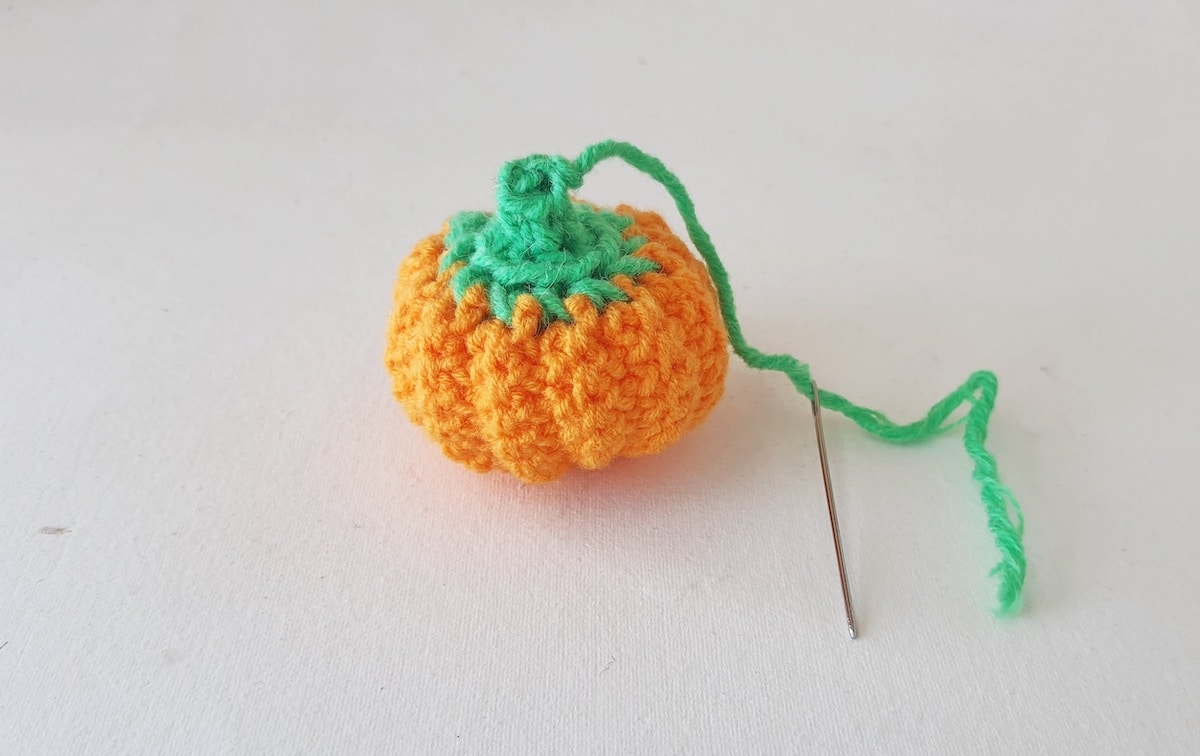 Crochet Pumpkin Step 31 against a white background
