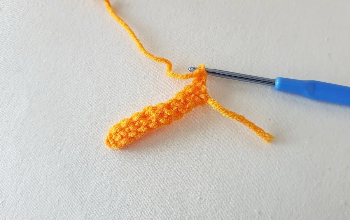 Crochet Pumpkin Step 4 against a white background