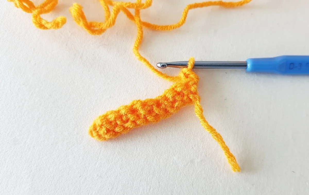 Crochet Pumpkin Step 6 against a white background