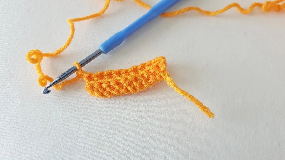 Crochet Pumpkin Step 7 against a white background
