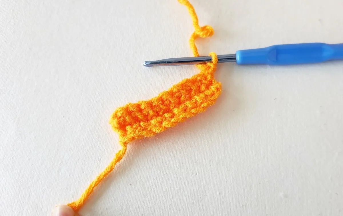 Crochet Pumpkin Step 8 against a white background
