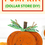 DIY Canning lid pumpkin against a white background
