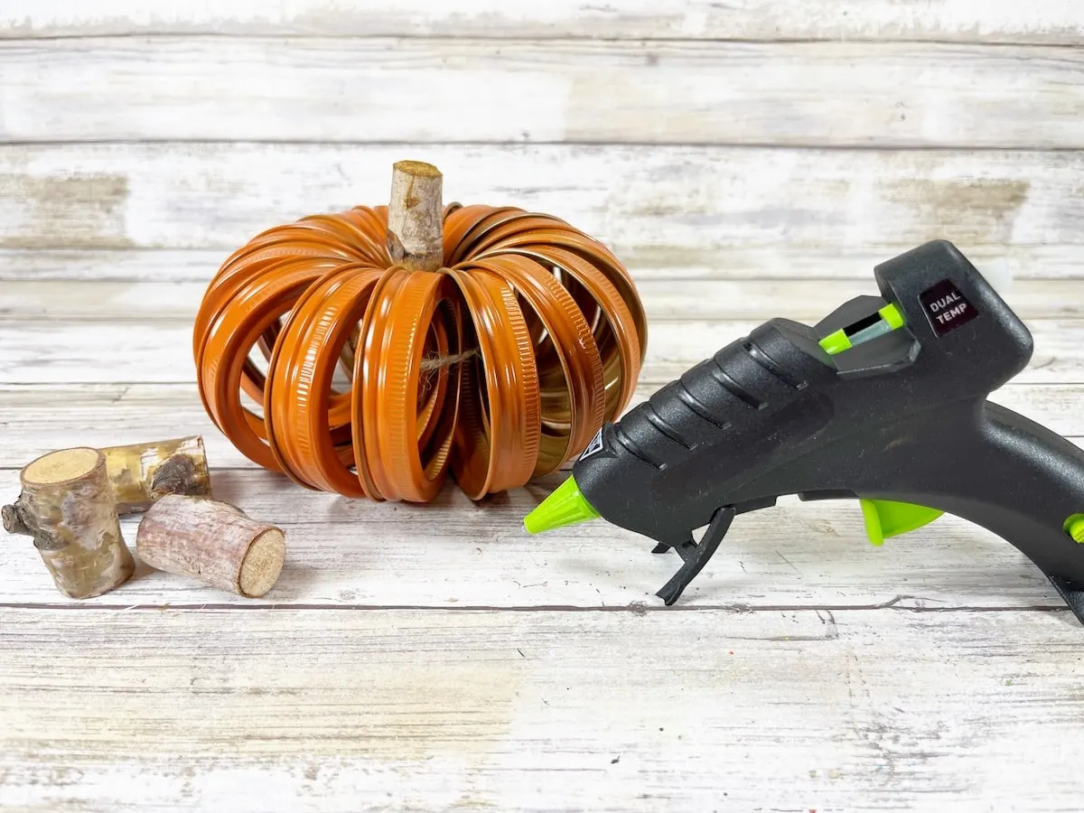 Canning Ring Pumpkin Step 5 on a light colored wood plank background