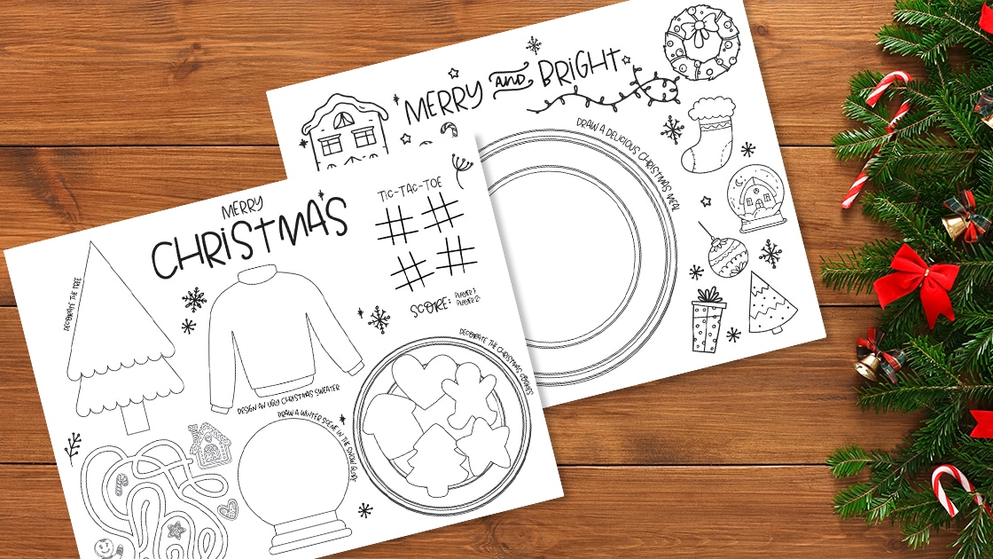 Two festive fairy light themed Christmas coloring pages on a wooden table.