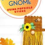 Diy scarecrow gnome made with popsicle sticks.