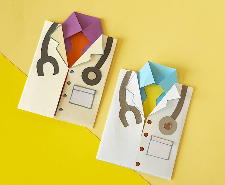 Two origami doctor card outfits on a yellow background.