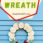 A wood slice winter wreath with cottagecore vibes.