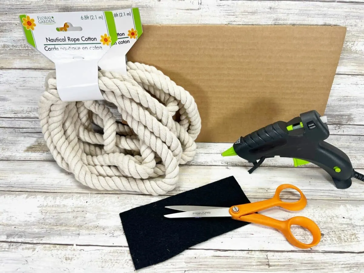 A box with scissors, a rope, and a box.