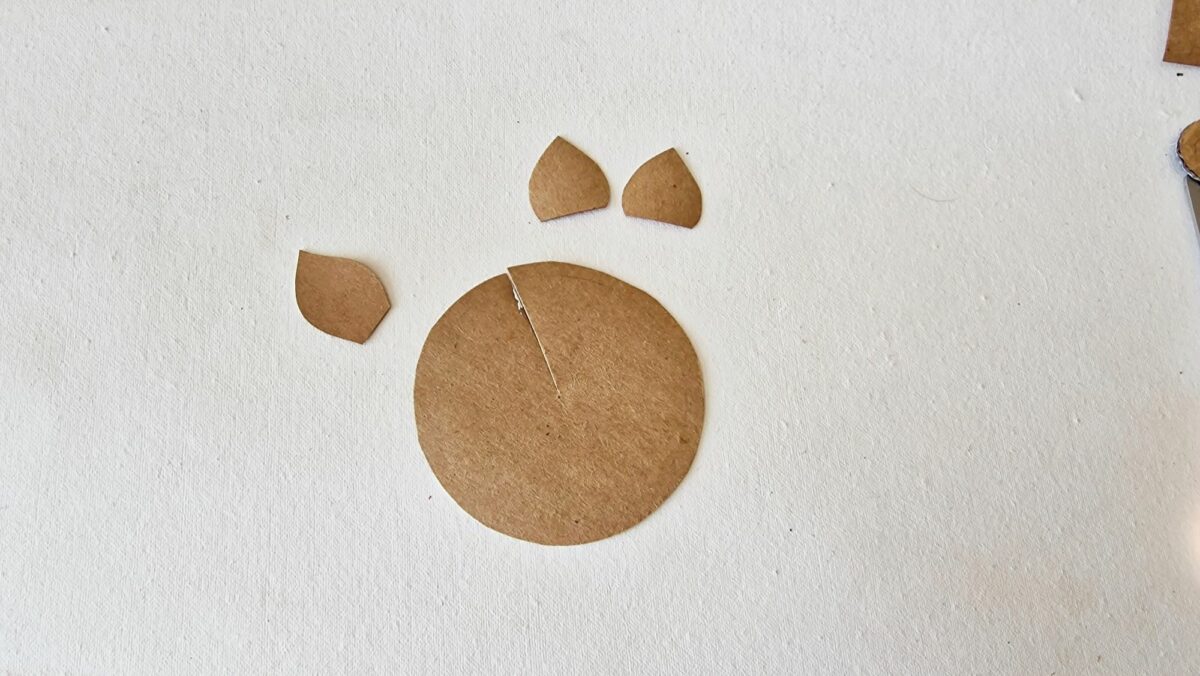 A brown paper cut out of a paw print.