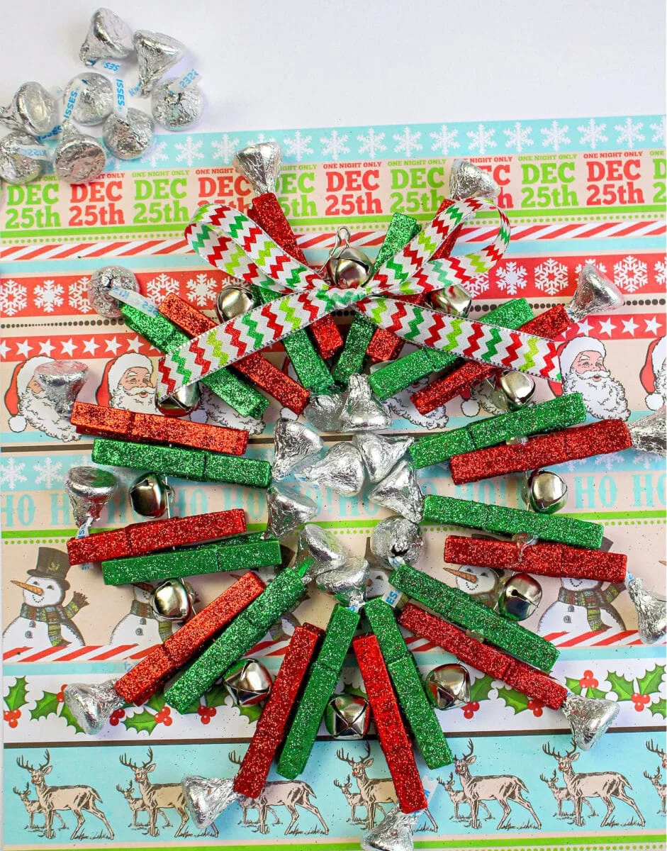 An advent wreath made from wrapping paper and candy canes.