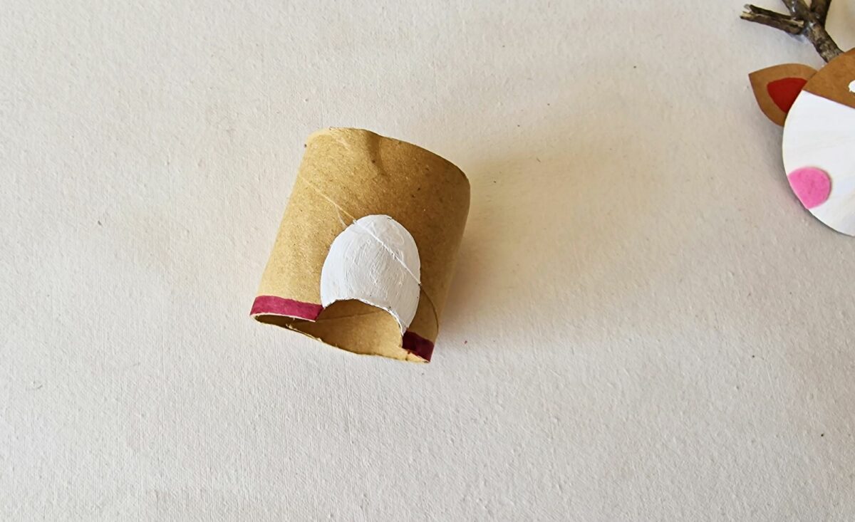 A toilet paper roll with a reindeer on it.