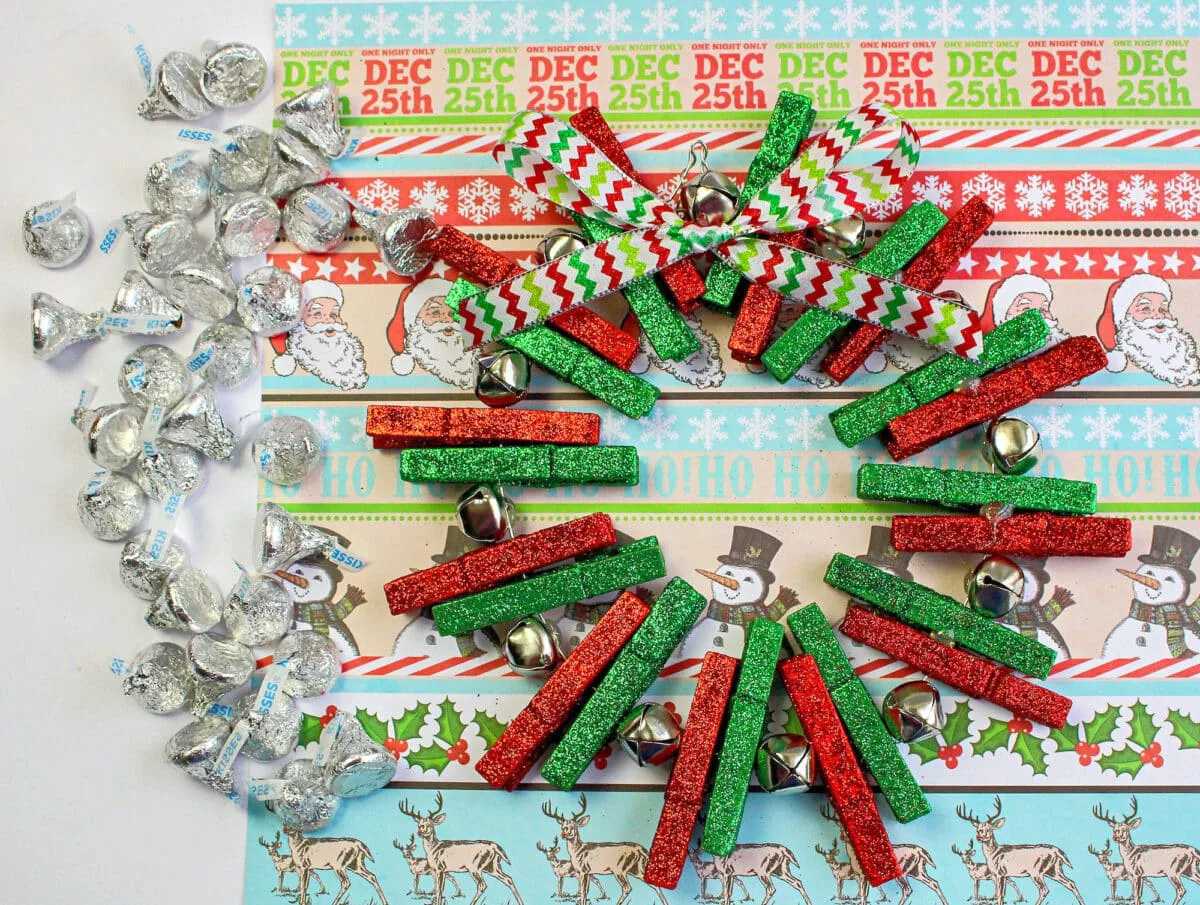 A festive advent wreath adorned with clothespins and candy canes.