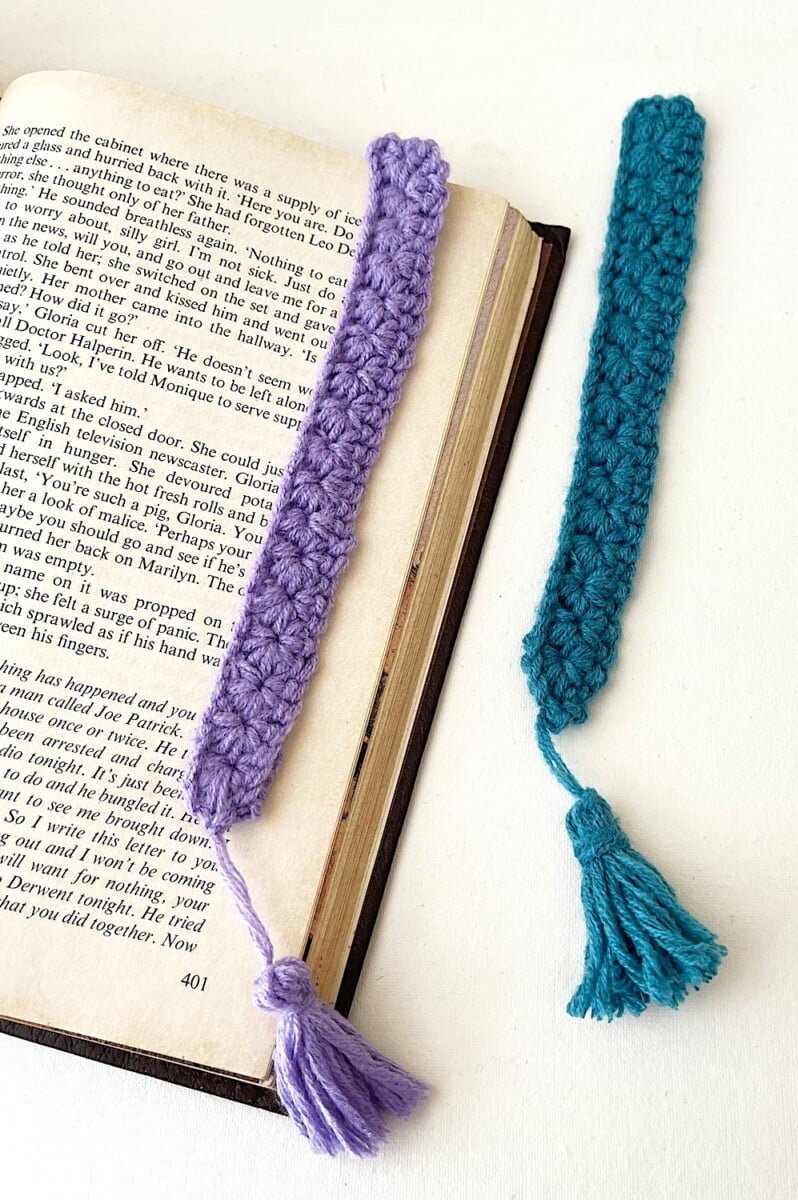 Crochet Bookmark On White Background next to open book