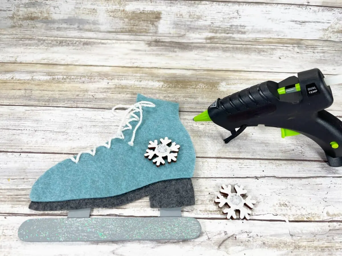 A pair of felt ice skates and a glue gun.