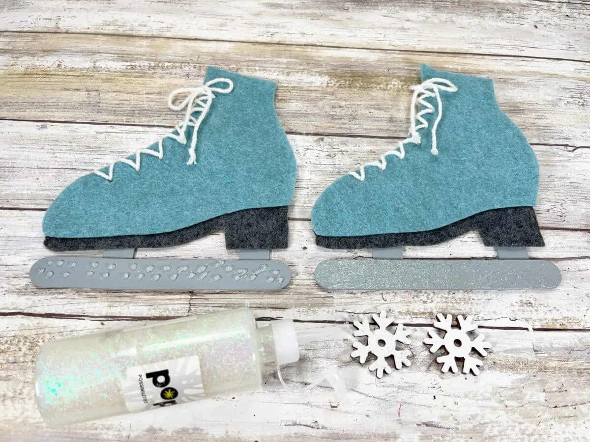 A pair of felt ice skates and a snowflake.