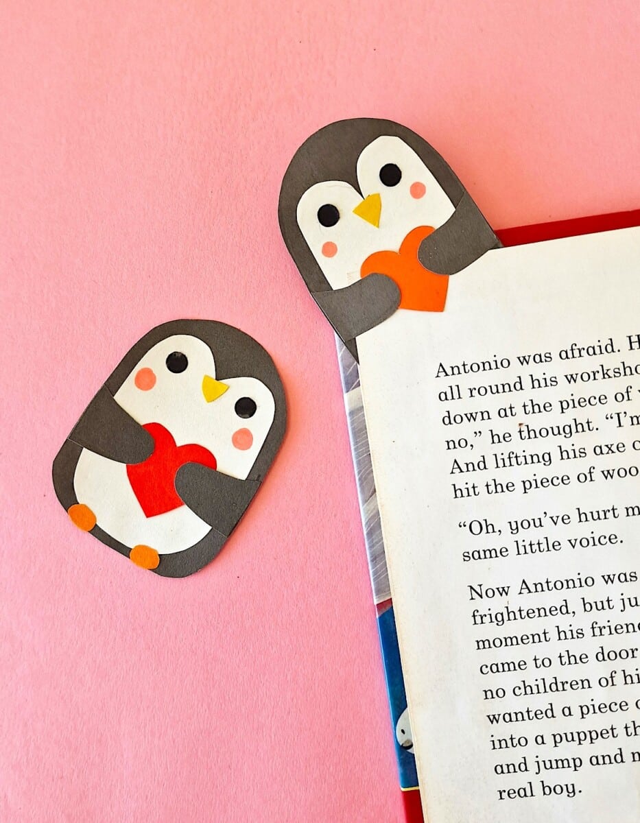 Penguin bookmarks on a pink background.