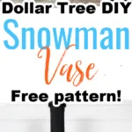 homemade snowman vase displayed against white background with faux greenery and wooden snowflakes
