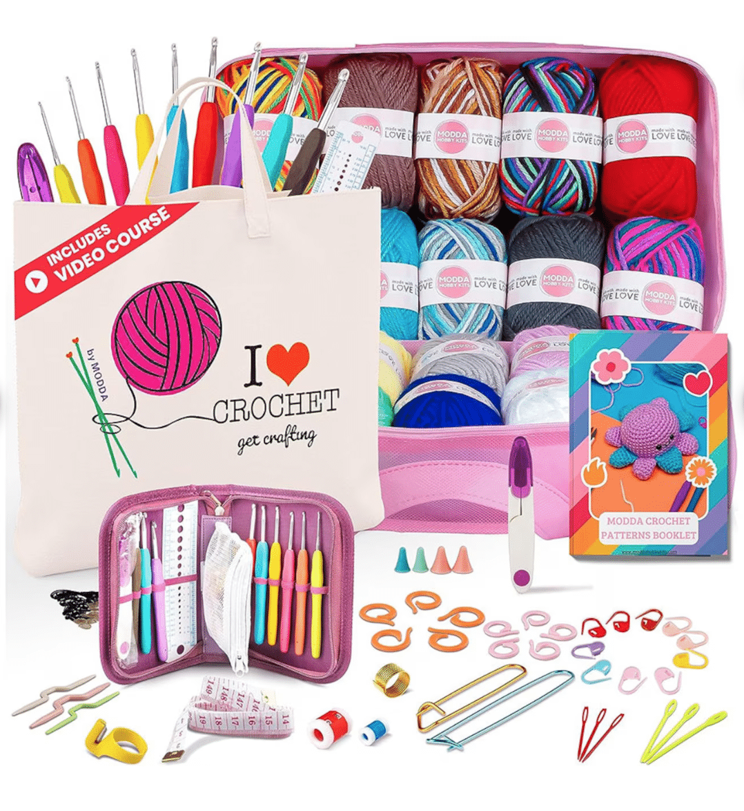 A pink bag filled with beginner crochet supplies.