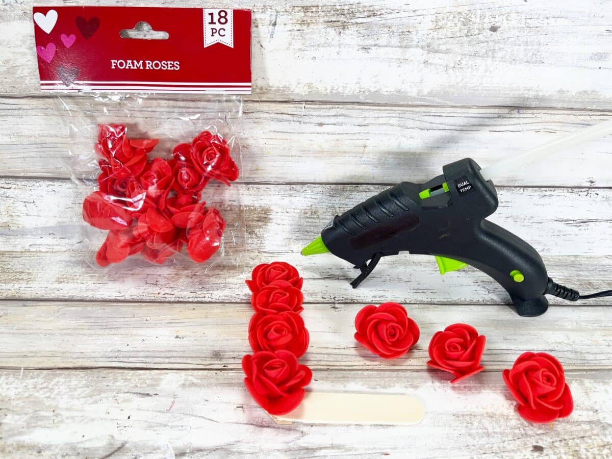 Valentine's day glue gun and red roses.