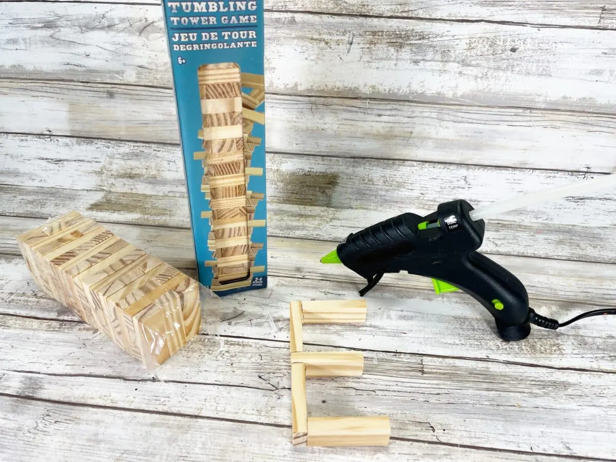 A set of wooden blocks and a glue gun.