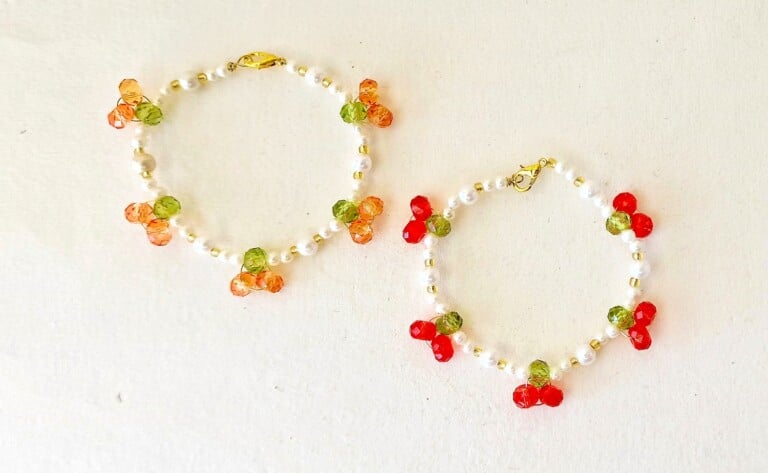 Cherry Bracelet with red beads on a white background