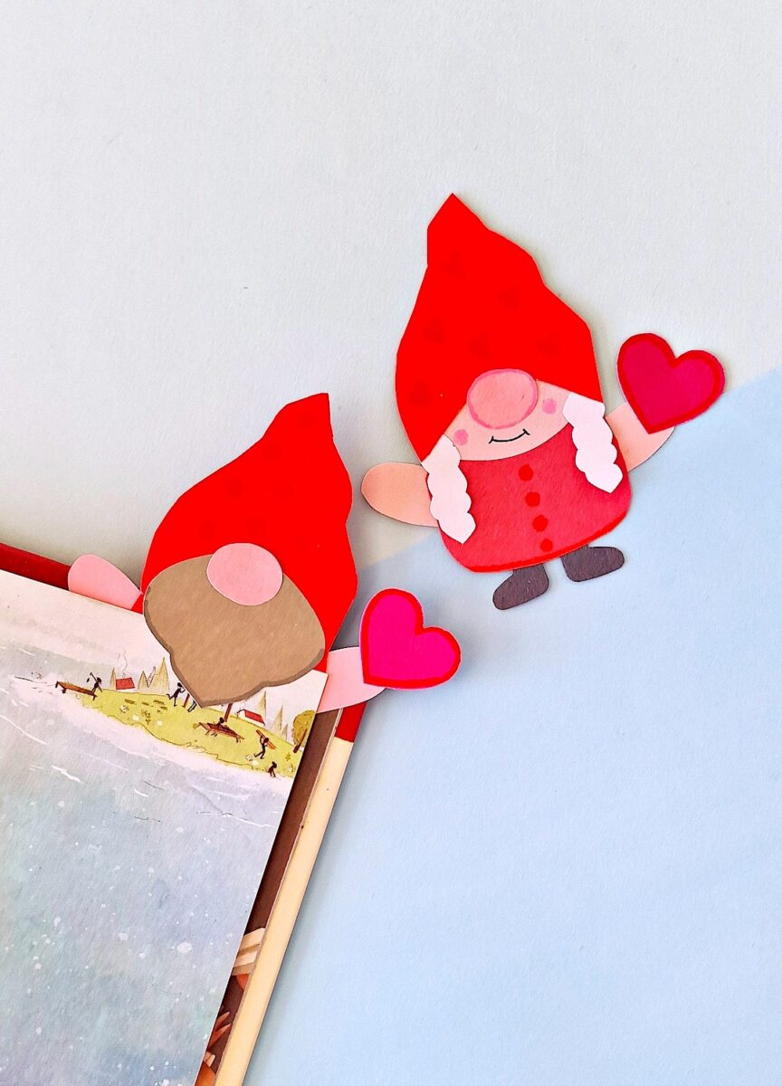 Valentine Gnome Bookmark next to an open book on a blue background