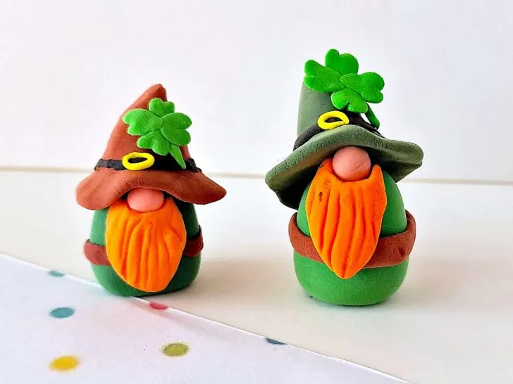 Clay Leprechaun Gnomes on a white table top with polka dots.