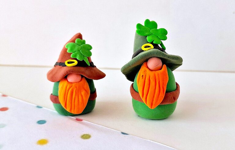 Clay Leprechaun Gnomes on a white table top with polka dots.