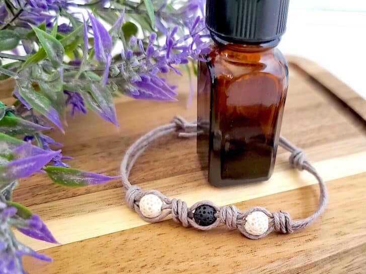 DIY Essential Oil Bracelet with a bottle of essential oil next to it.