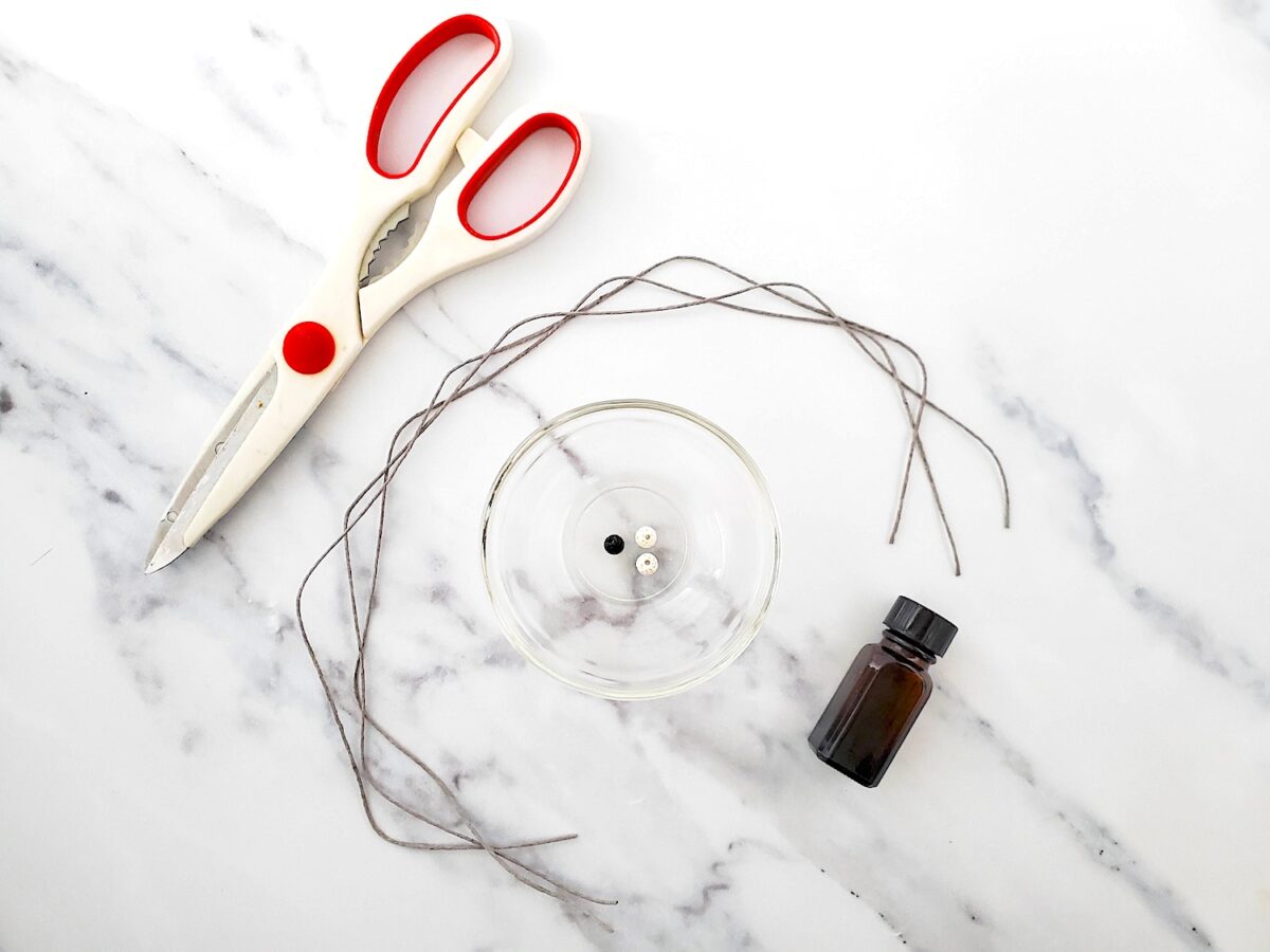 DIY Essential Oil Bracelet Supplies on a marble table.