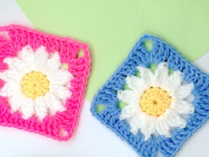 Crochet Daisy Granny Squares on a green background.