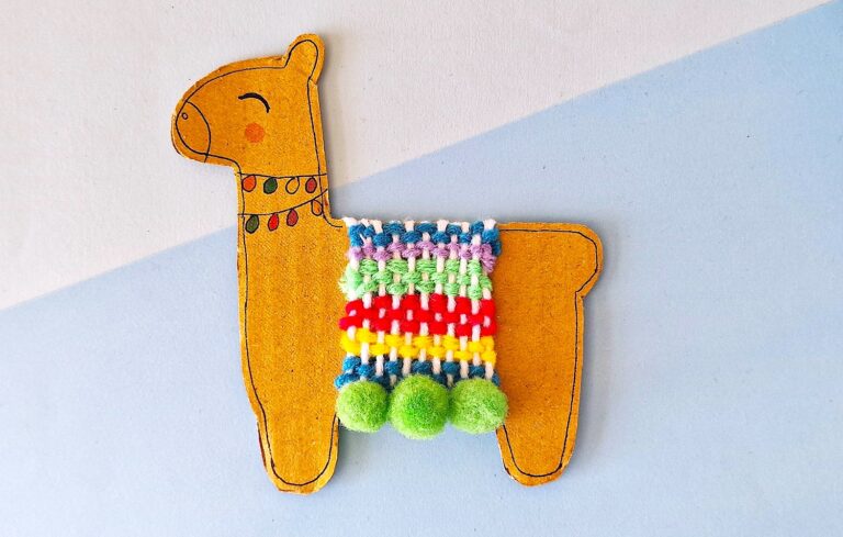 Llama Craft with colorful pom poms hanging from it.