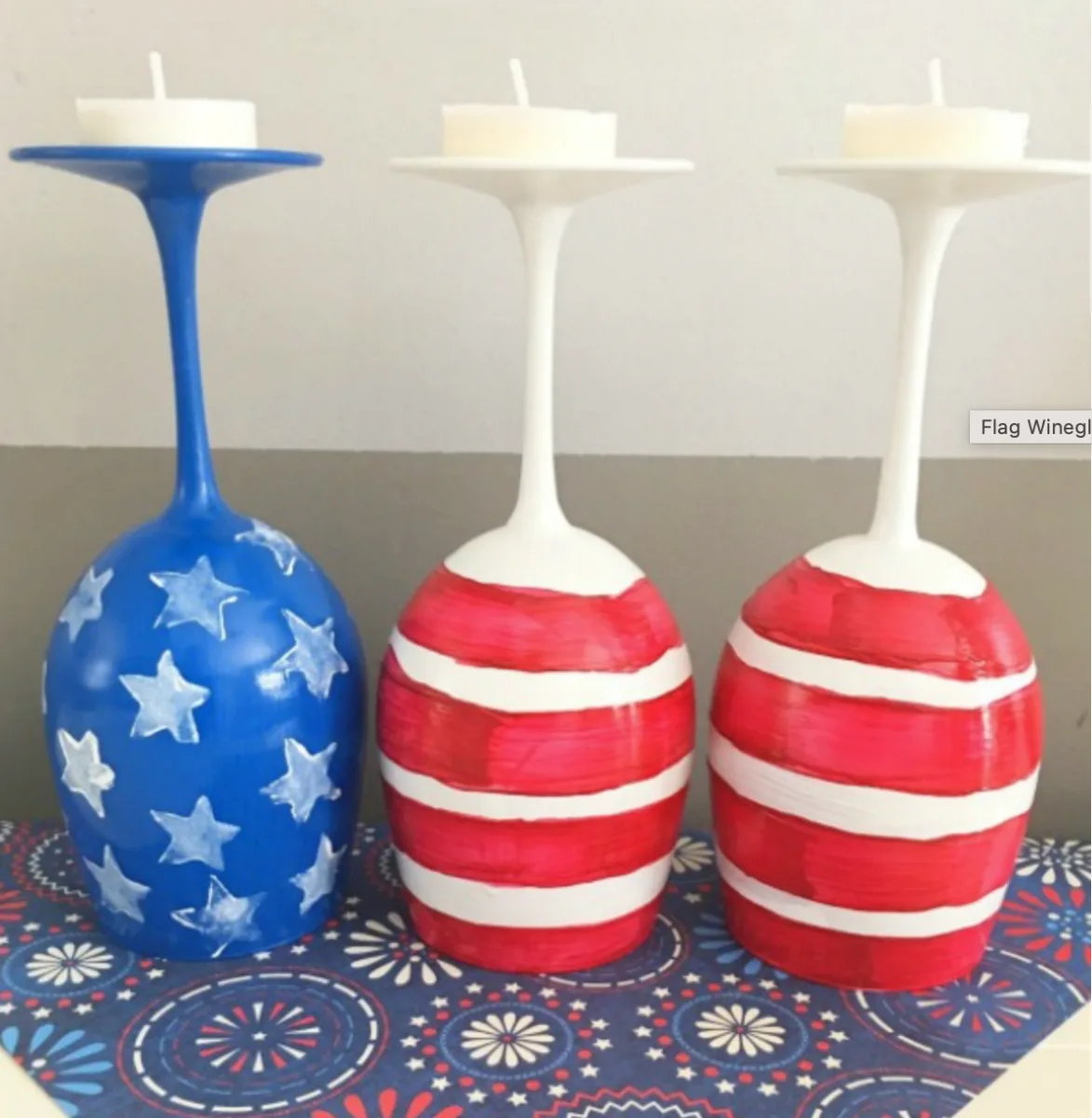 three wine glasses turned upside down and painted as an American flag