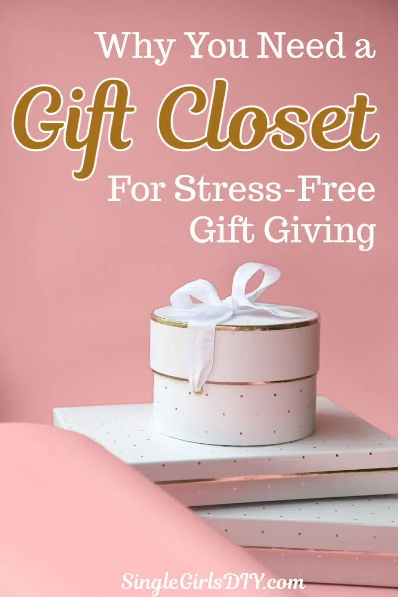 A pink background with a white gift box tied with a ribbon, placed on white boxes. Text reads: "Why You Need a Gift Closet for Stress-Free Gift Giving." SingleGirlsDIY.com.