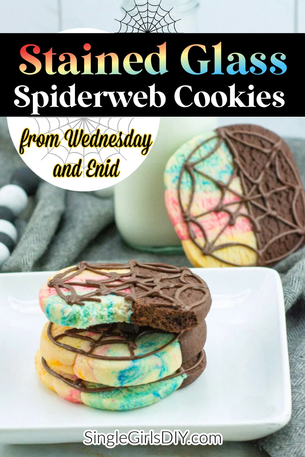 A plate of marbled Wednesday Enid cookies decorated with chocolate spiderweb designs, with milk and another cookie in the background. Text overlay reads “Stained Glass Spiderweb Cookies.”.