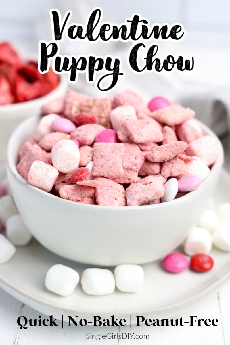 A bowl of pink and white Valentine-themed puppy chow mix with marshmallows and candy, labeled as quick, no-bake, and peanut-free.