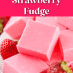 A plate of pink strawberry fudge squares, surrounded by fresh strawberries, with text overlay: "No-Bake Strawberry Fudge, Easy Valentines Treat!.