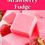 A plate of pink strawberry fudge squares, surrounded by fresh strawberries, with text overlay: "No-Bake Strawberry Fudge, Easy Valentines Treat!.