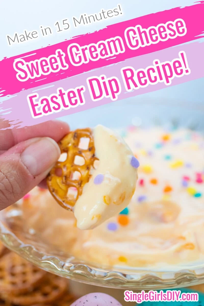 Close-up of a pretzel being dipped into a sweet Easter dip made with cream cheese and colorful sprinkles. Text overlay reads "Make in 15 Minutes! Sweet Cream Cheese Easter Dip Recipe!.