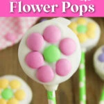 A cookie pop decorated with pink and green flower-shaped candy on a green polka dot stick. Background shows more similar pops. Text reads "Easy Oreo Flower Pops".