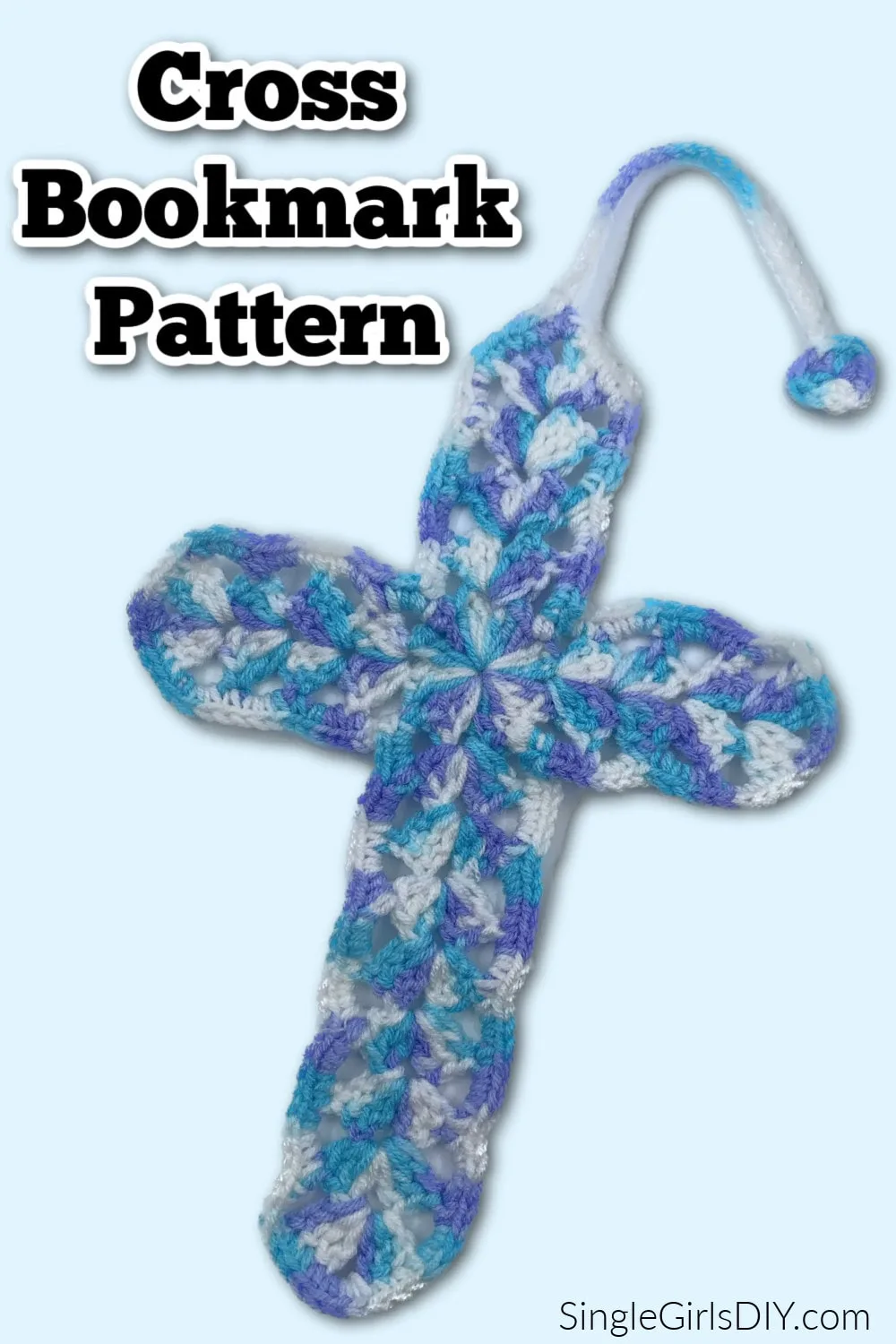 Discover our exquisite crochet cross bookmark in shades of blue, white, and purple yarn, complete with a loop on top. Perfect for adding a touch of elegance to any book. Embrace your creativity with this unique cross bookmark pattern today!.